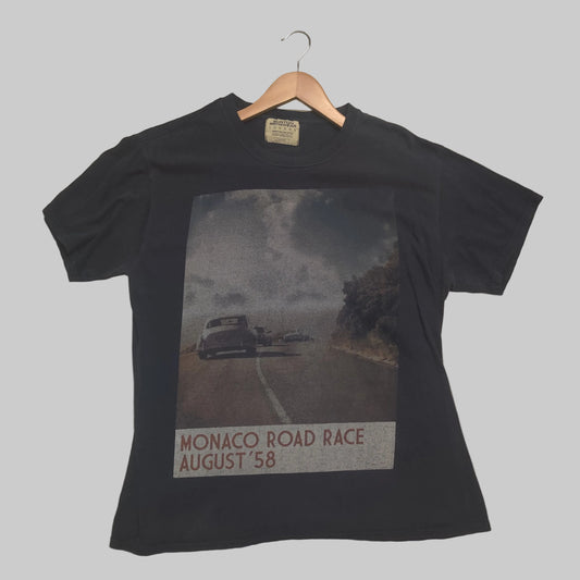 Black t-shirt with Monaco Road Race graphic on a wooden surface